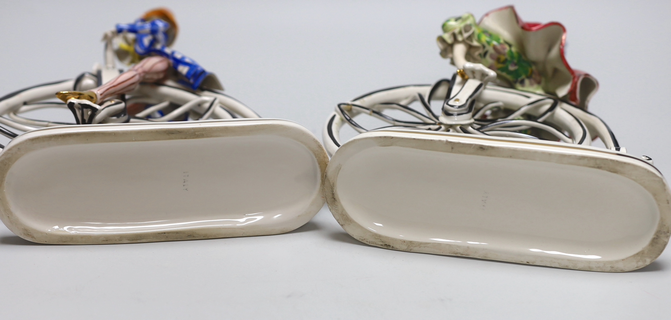 A pair of 1950’s- 60’s Italian ceramic penny farthing cyclists, 31cm